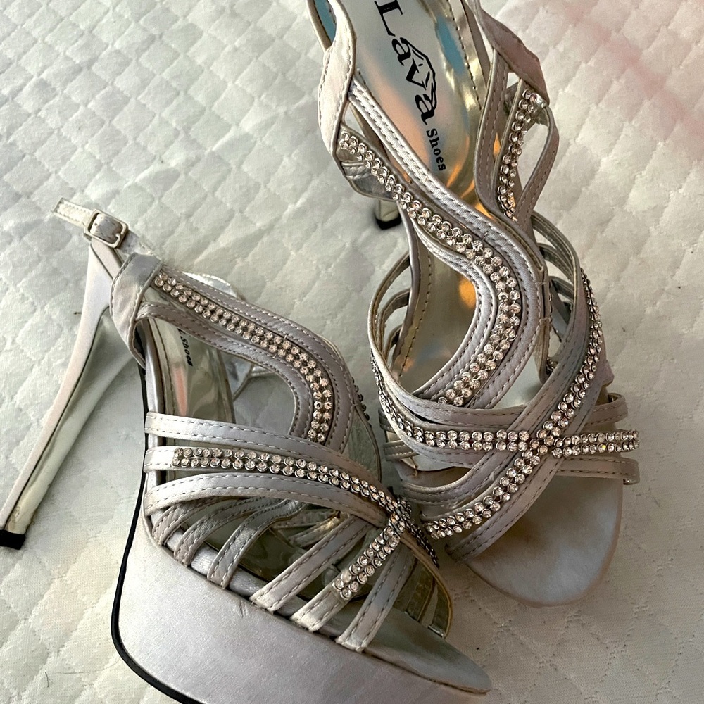 Jeweled silver strappy shoes.